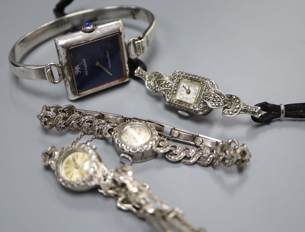 Three ladys assorted silver cocktail wrist watches and a sterling watch.